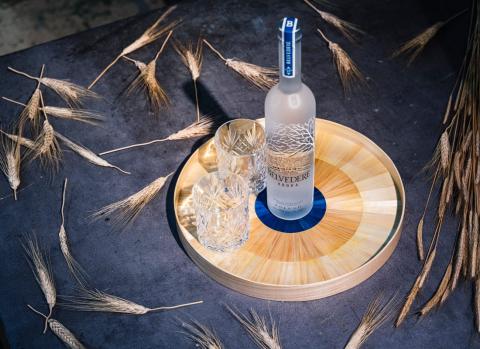 bottle on tray with glasses and rye