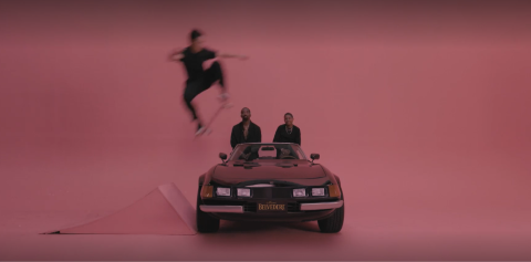 man jumping car on skateboard