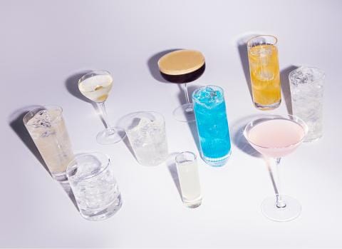 An assortment of Belvedere vodka-based cocktails on a white backdrop