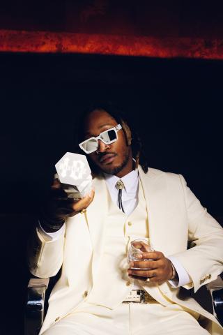 Global music icon Future holding Belvedere 10 luxury spirit bottle.